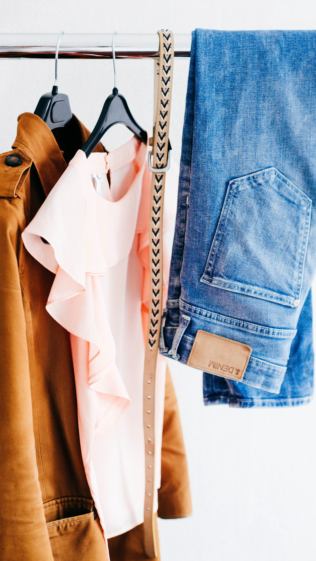 women's four assorted apparel hanged on clothes rack
